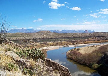 Kayakers at the mouth of Santa Elena Canyon, Big Bend National Park in Texas.