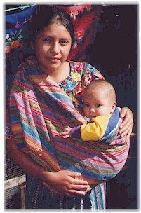 Maya women keep their babies close as they weave.