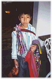 A young Maya boy selling tipica.