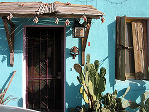 Barrio home with turquoise walls.