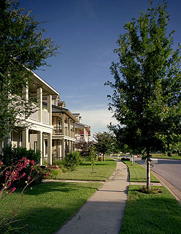 Sidewalks, planting strips, and street trees are part of Plum Creek's focus on pedestrians.