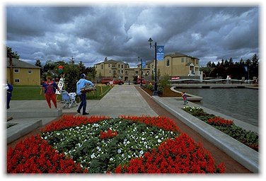 Flowers, promenade, and Villas on the Lake