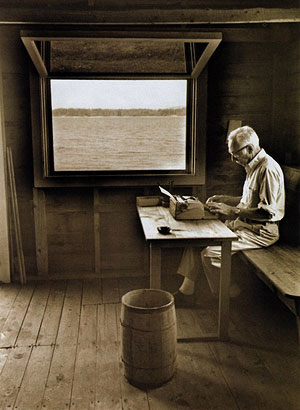 E.B. White writes in the boathouse
