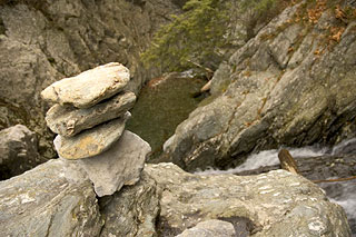 Cairn above waterfall.
