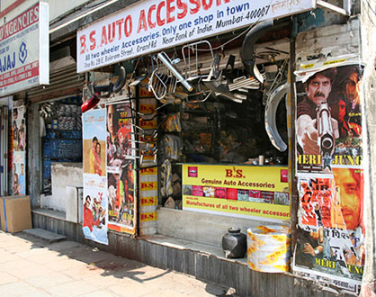 Bollywood posters on a shop wall.