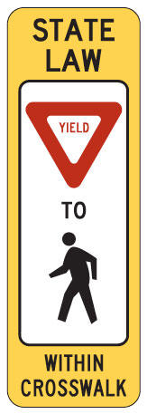 Sign: State Law: Yield to pedestrians within crosswalk