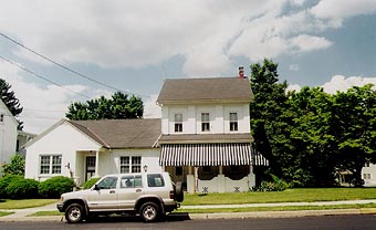 The Updike house, complete with silver SUV.