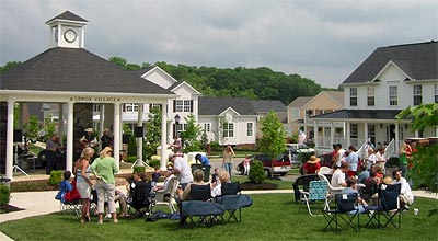 image, Wooded hillsides, open space, and stream channel mitigation.