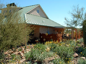 Milagro Cohousing home, with lush landscaping.