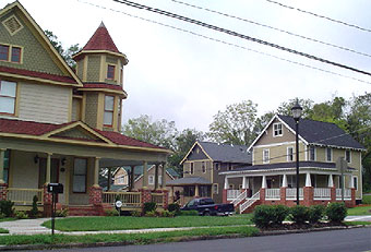 Historic home after renovation, with infill homes.