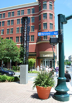Artwork, retail, and residential at Rockville Town Square's southern entrance. 