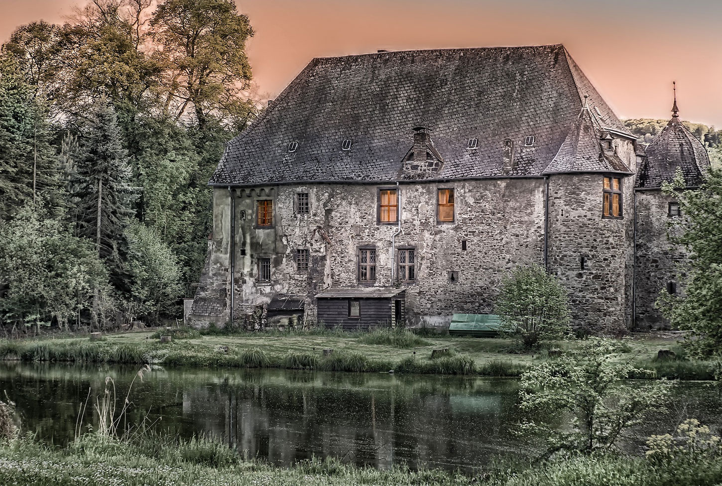Old cottage among trees