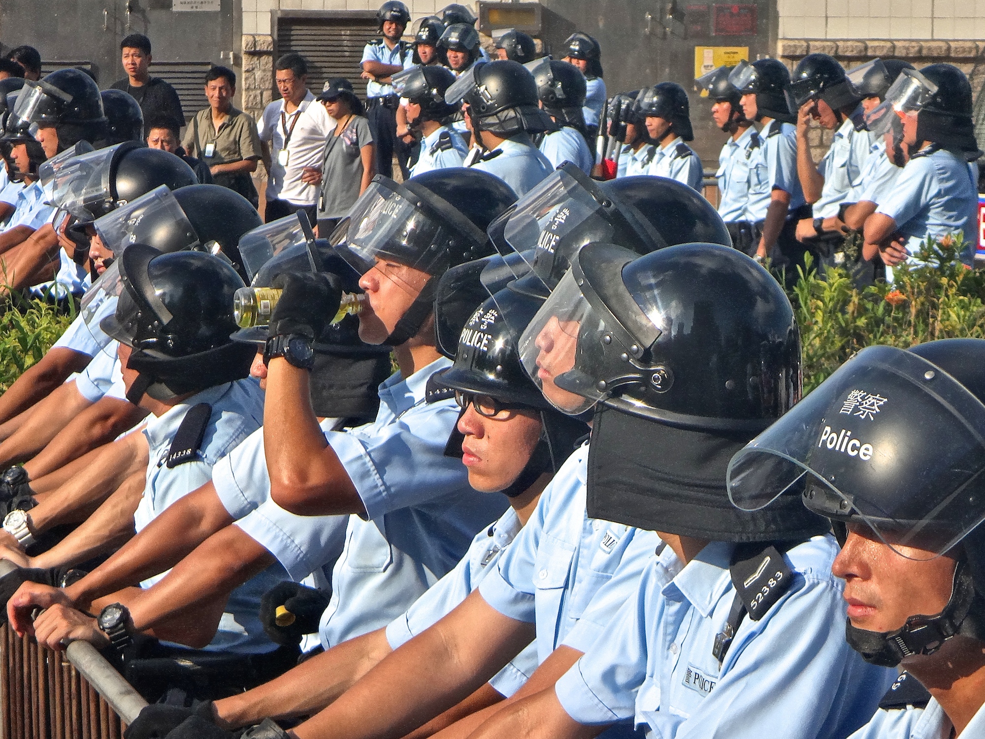 The front-line police look almost as young as the student demonstrators. In the early tenser days the sun made everyone hot, but the officers seemed more stressed than the protestors.