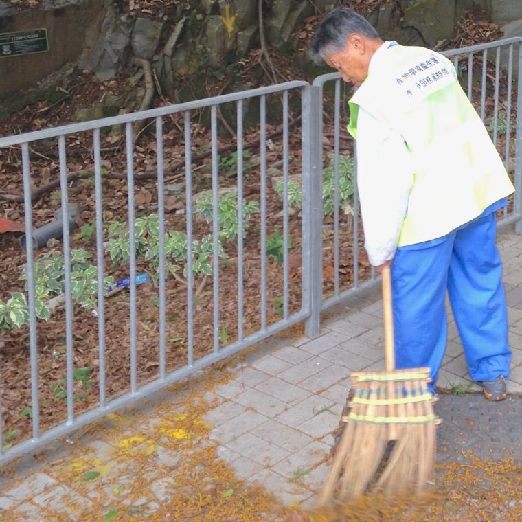 The sidewalk will be swept. The trash behind the fence will stay.