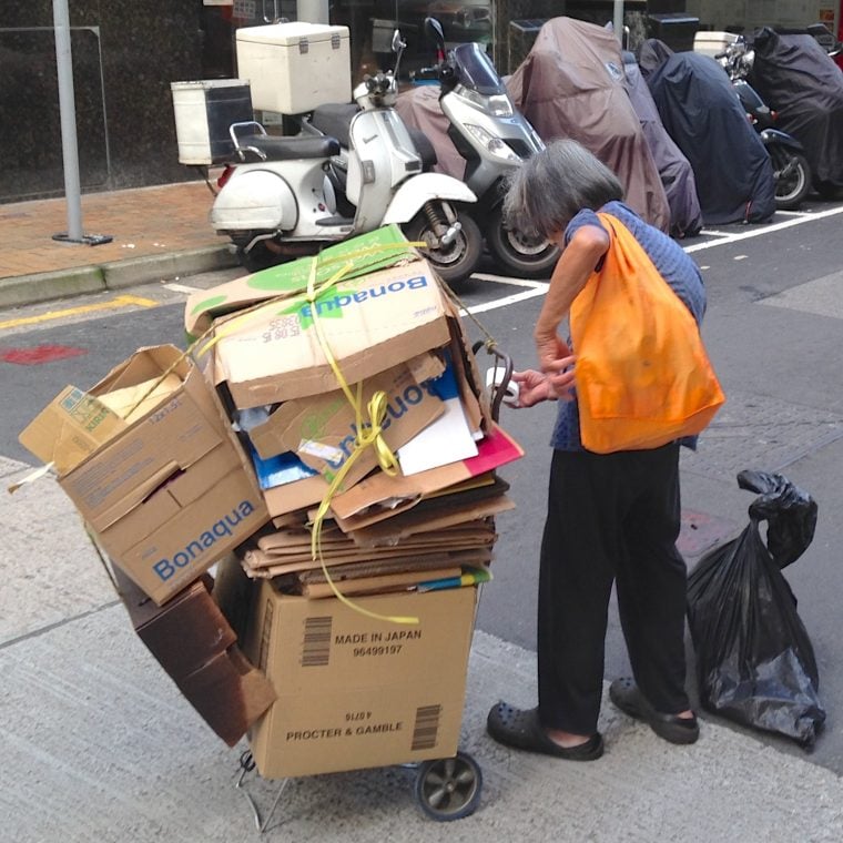Flattened boxes will become ground mats for domestic helpers.