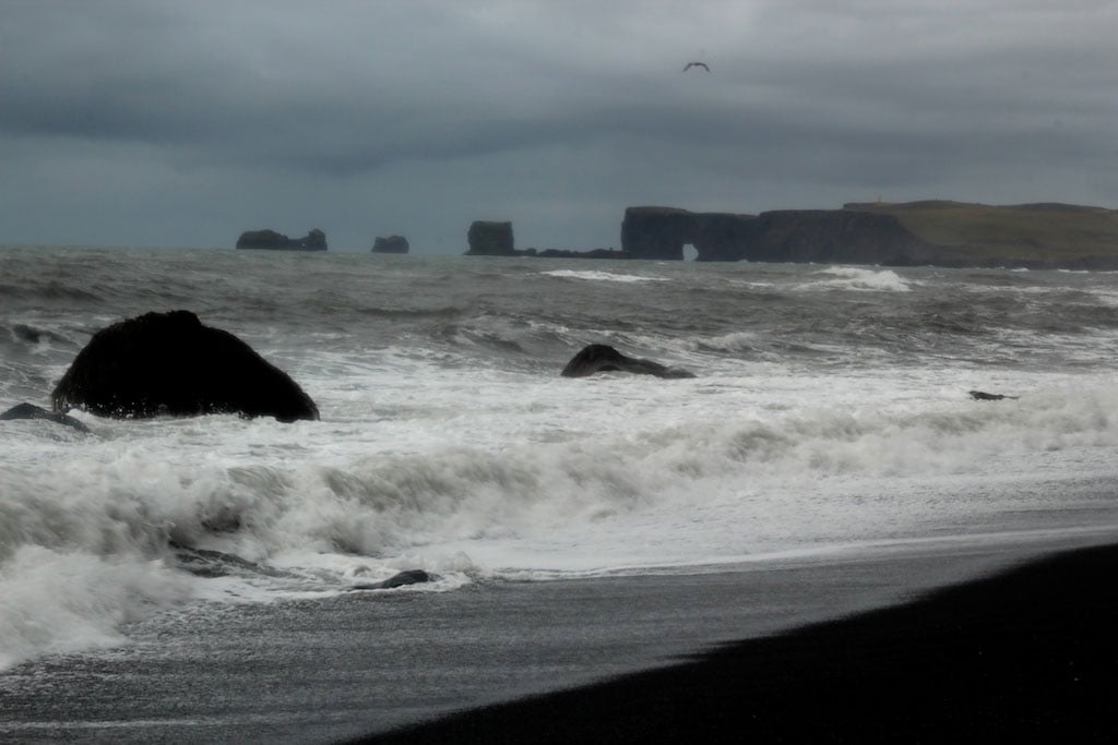 crashing waves and keyhole cliffs