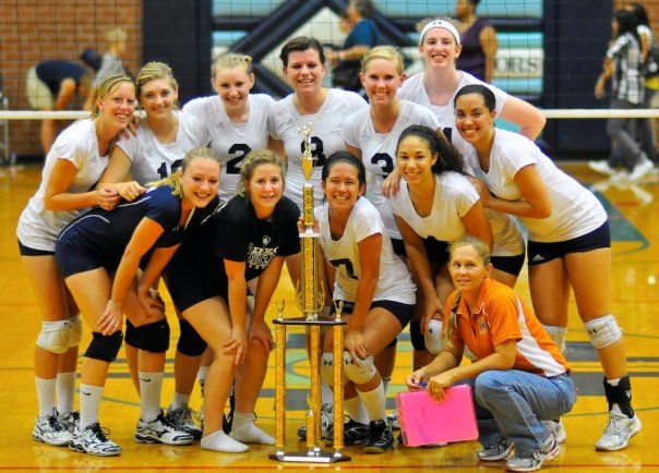High school volleyball team with trophy