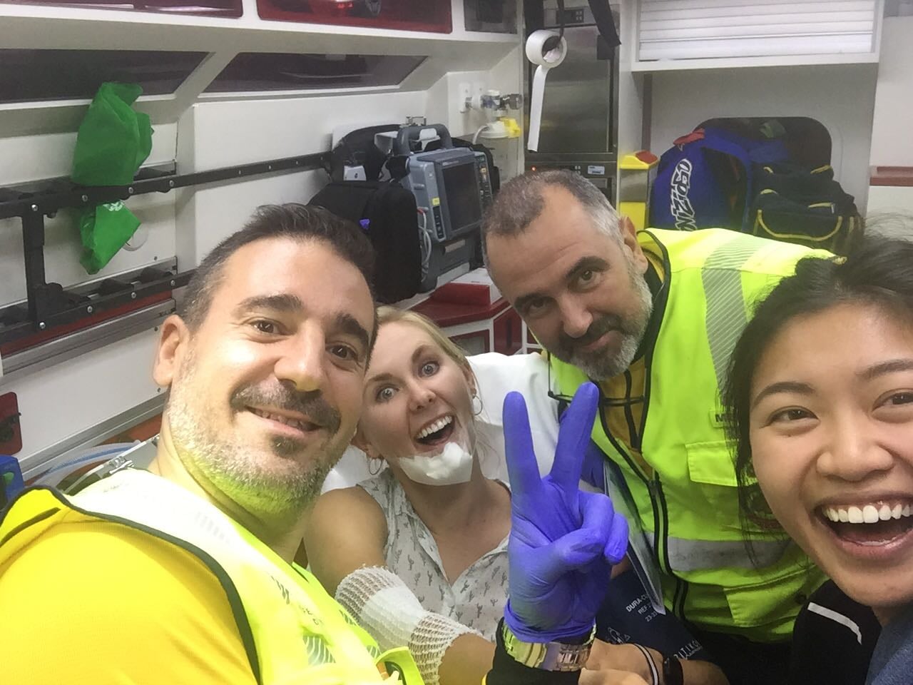 Zoe, her friend, and two ambulance men