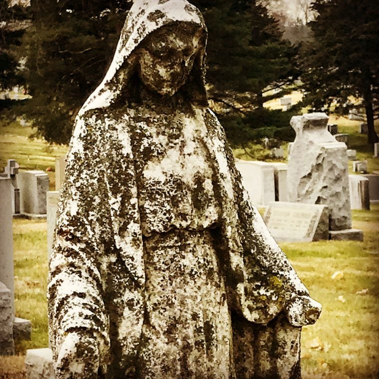 Photo of statue in cemetery by by Kristina Moriconi.