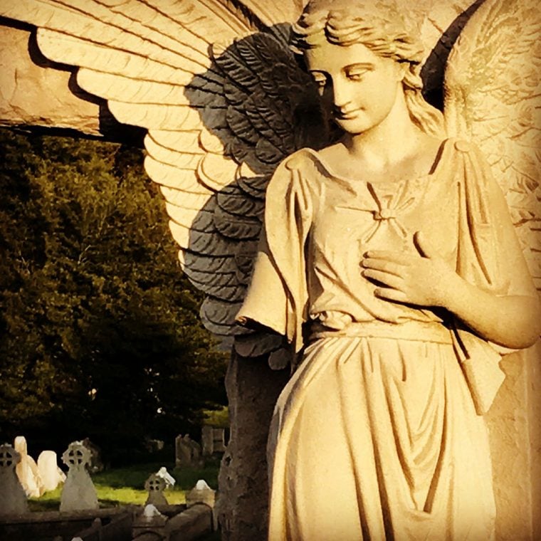 Photo of statue in cemetery by by Kristina Moriconi.