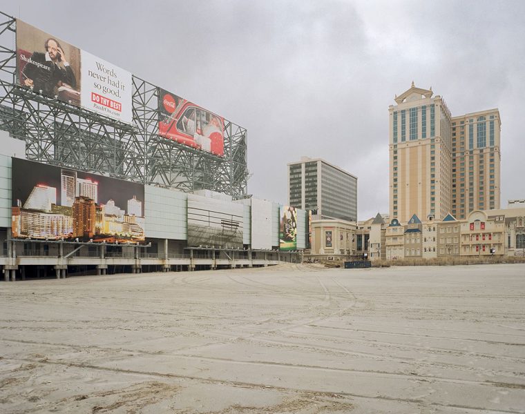 Empty parking lot, casino, and billboards in Atlantic City