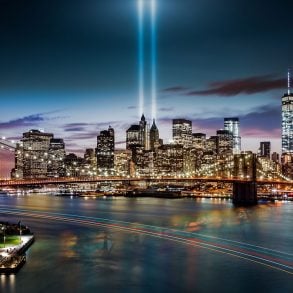 New York City skyline with 9/11 Memorial lights at night