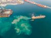 Aerial view of cargo ship leaving port