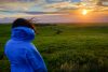 Garrett's daughter overlooking landscape at sunset