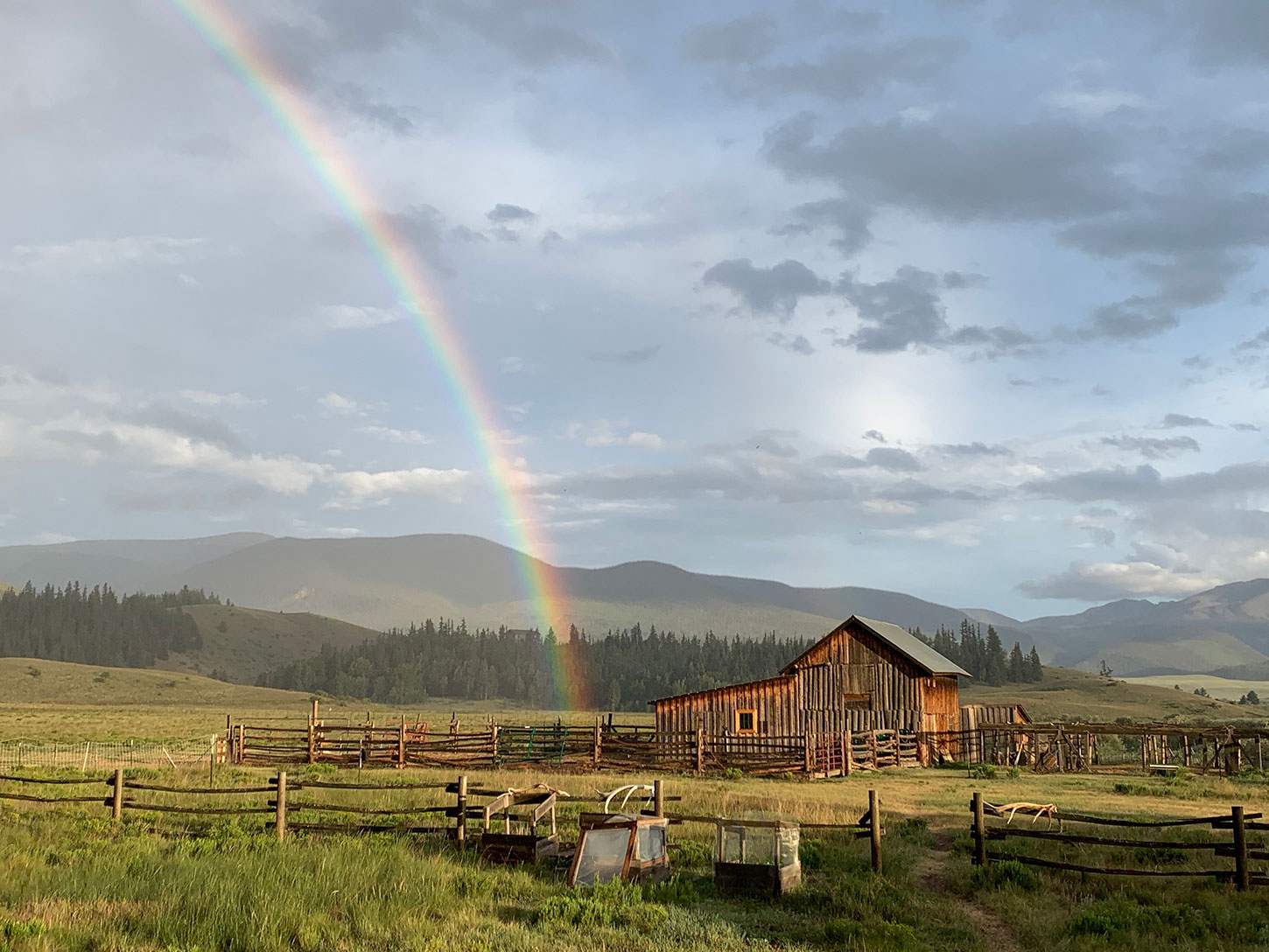 Rainbow ending in the barn on Pam Houston's Colorado ranch