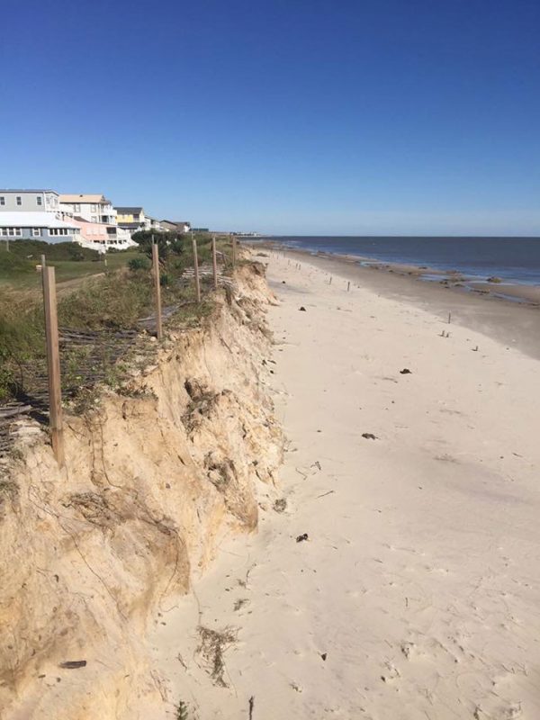 Beach with homes on bluff