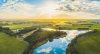 River and farmland at sunset (or sunrise)