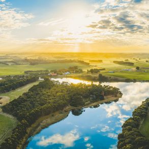 River and farmland at sunset (or sunrise)