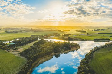 River and farmland at sunset (or sunrise)