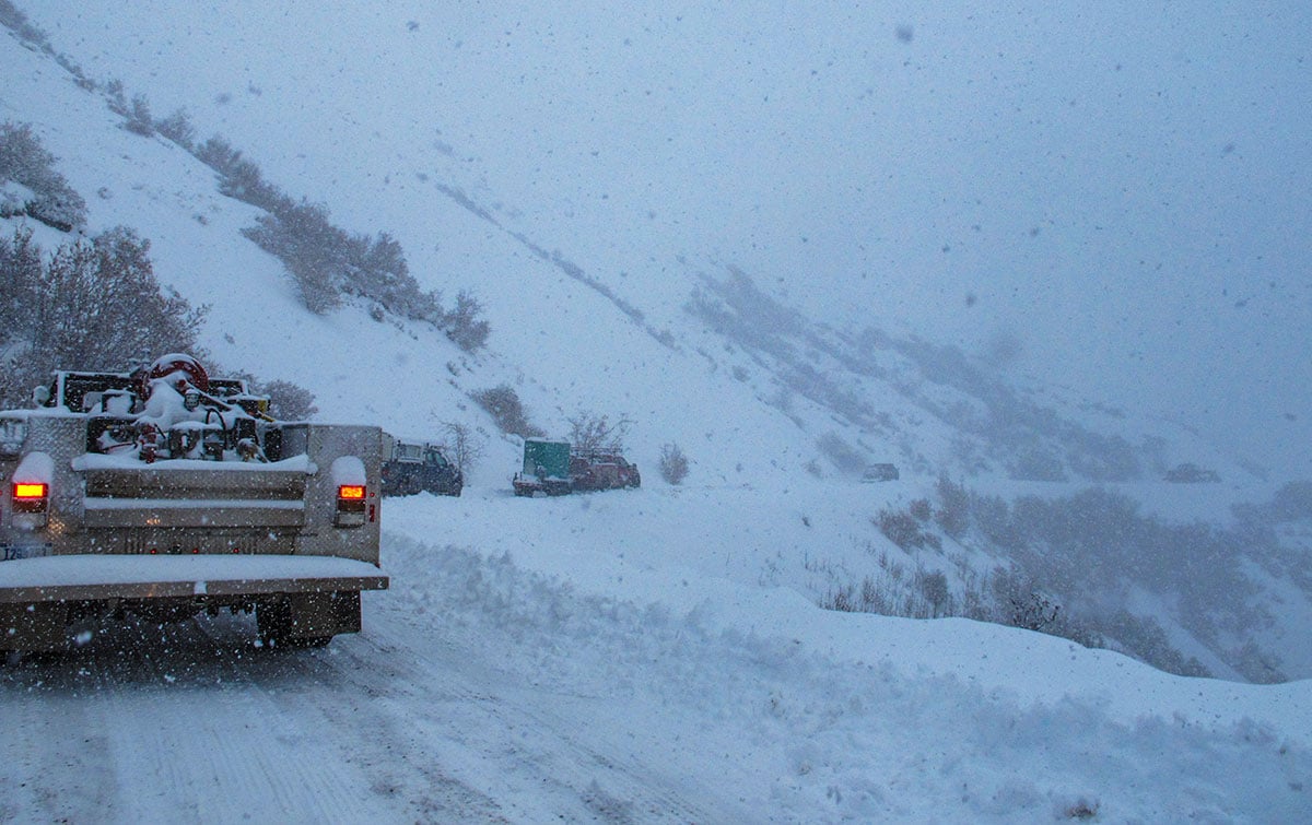 Vehicles on Polychrome Pass in the snow