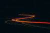 Taillights at night on winding road