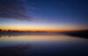 Twilight with stars over pond