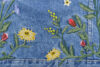 Flowers embroidered onto denim