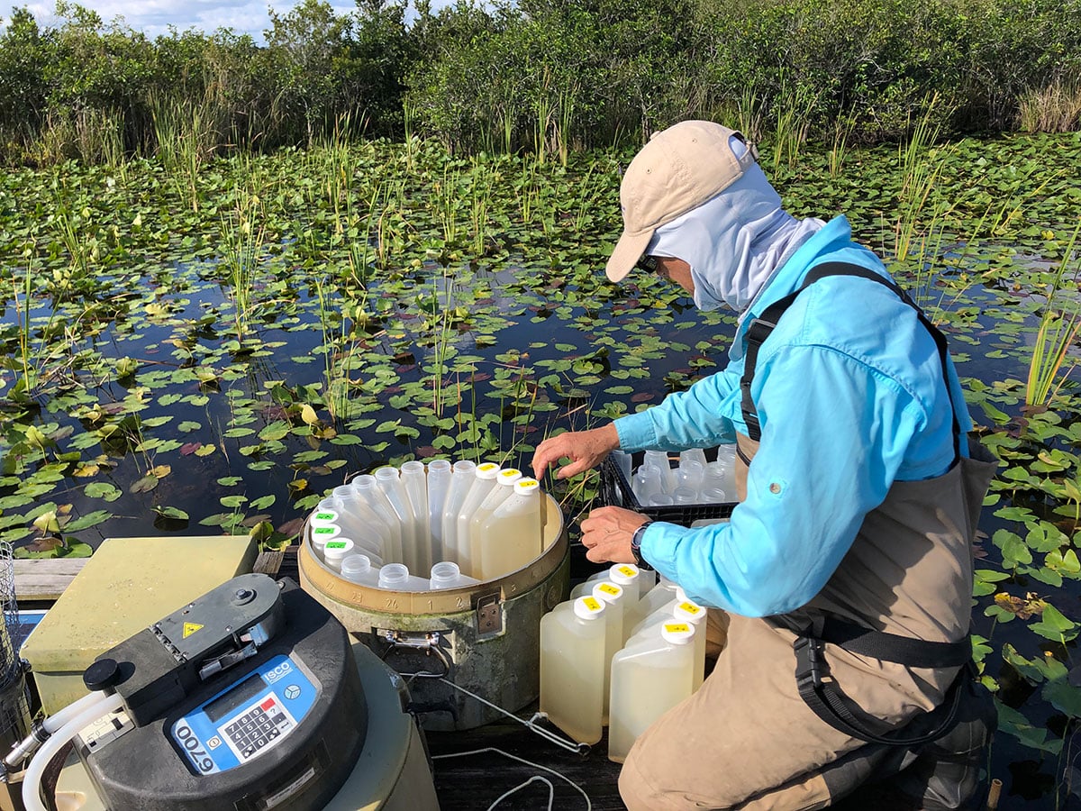 Rafael Travieso, lab manager, servicing an autosampler on the Shark River Slough