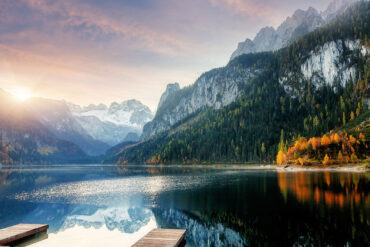 Sunrise over alpine lake in autumn
