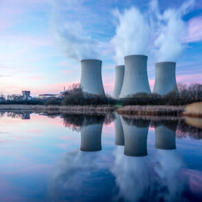 Nuclear plant on edge of water at twilight