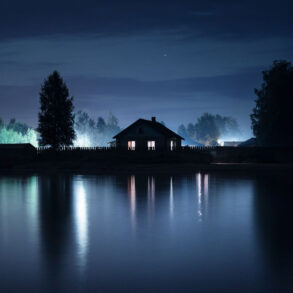 House on lake at night