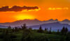 Orange-sky sunrise over mountains
