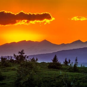 Orange-sky sunrise over mountains