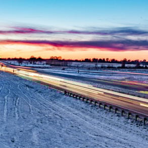 Interstate at sunset with snow
