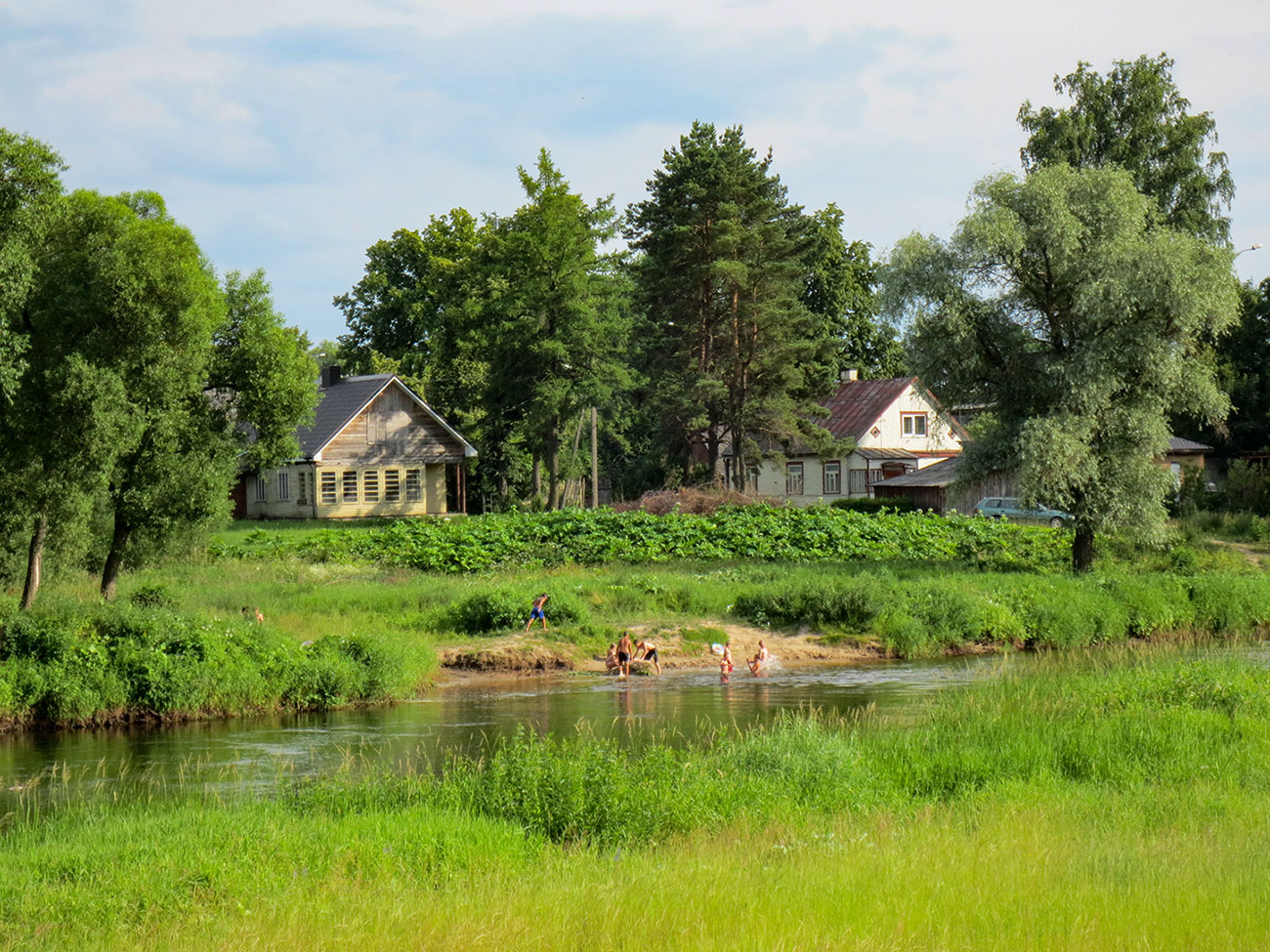 Boys wading in river at Ukmergė