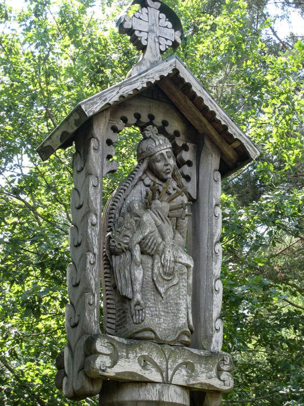 Carved wood religious symbol.