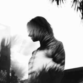 Woman, shadow, palms
