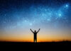 Man silhouetted against starry sky