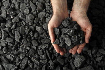 Hands holding coal