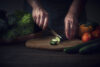Hands cutting vegetables